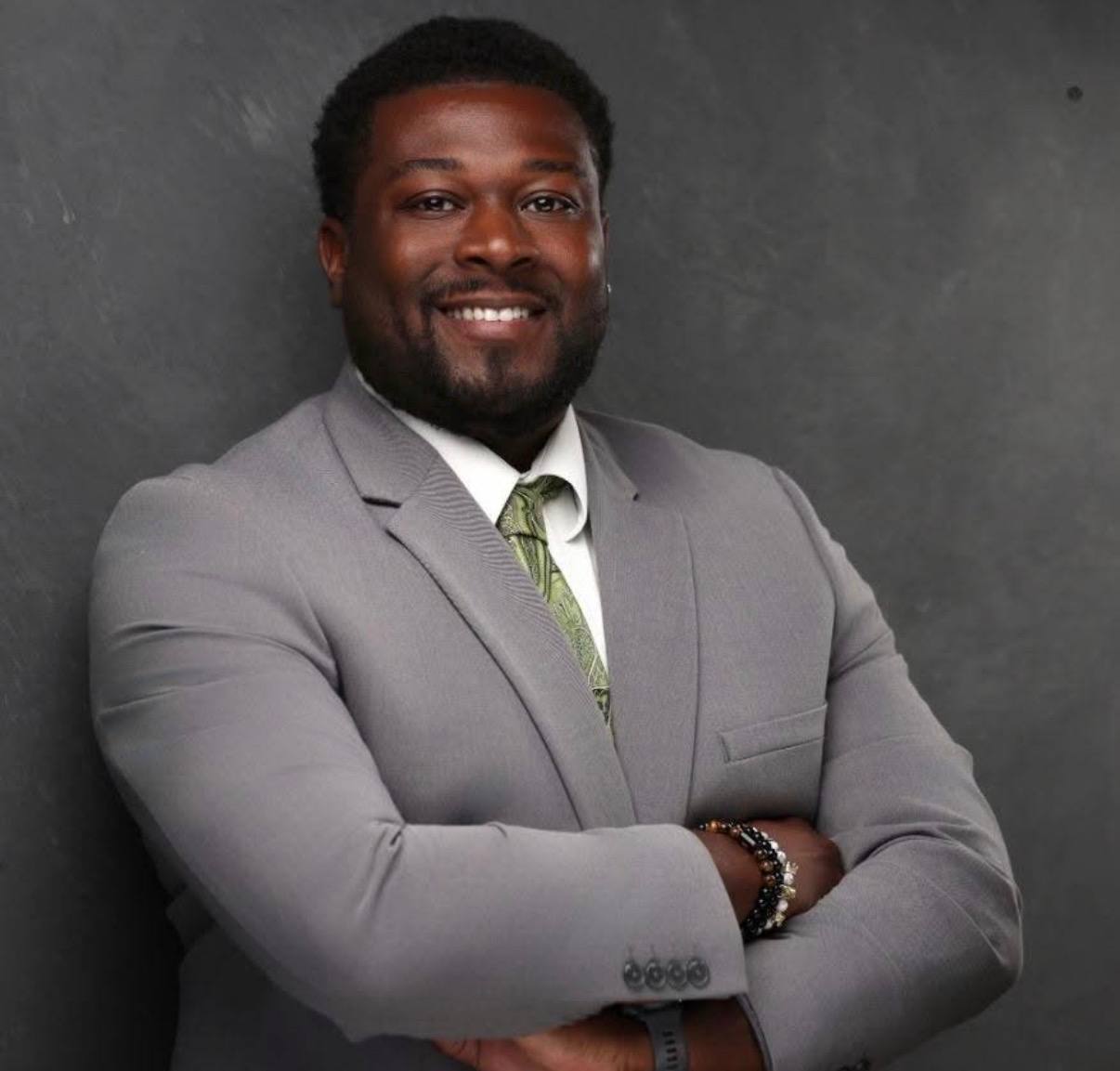 Davonta Brown in a gray suit