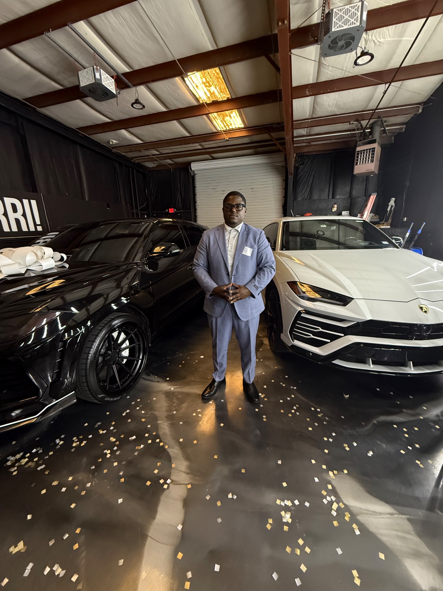 Tarad Humphrey standing between vehicles